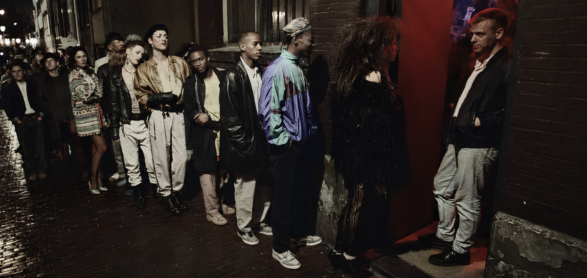 Editorial recreation of a late 1980s club queue beside an Amsterdam canal, with red light spilling from the doorway.