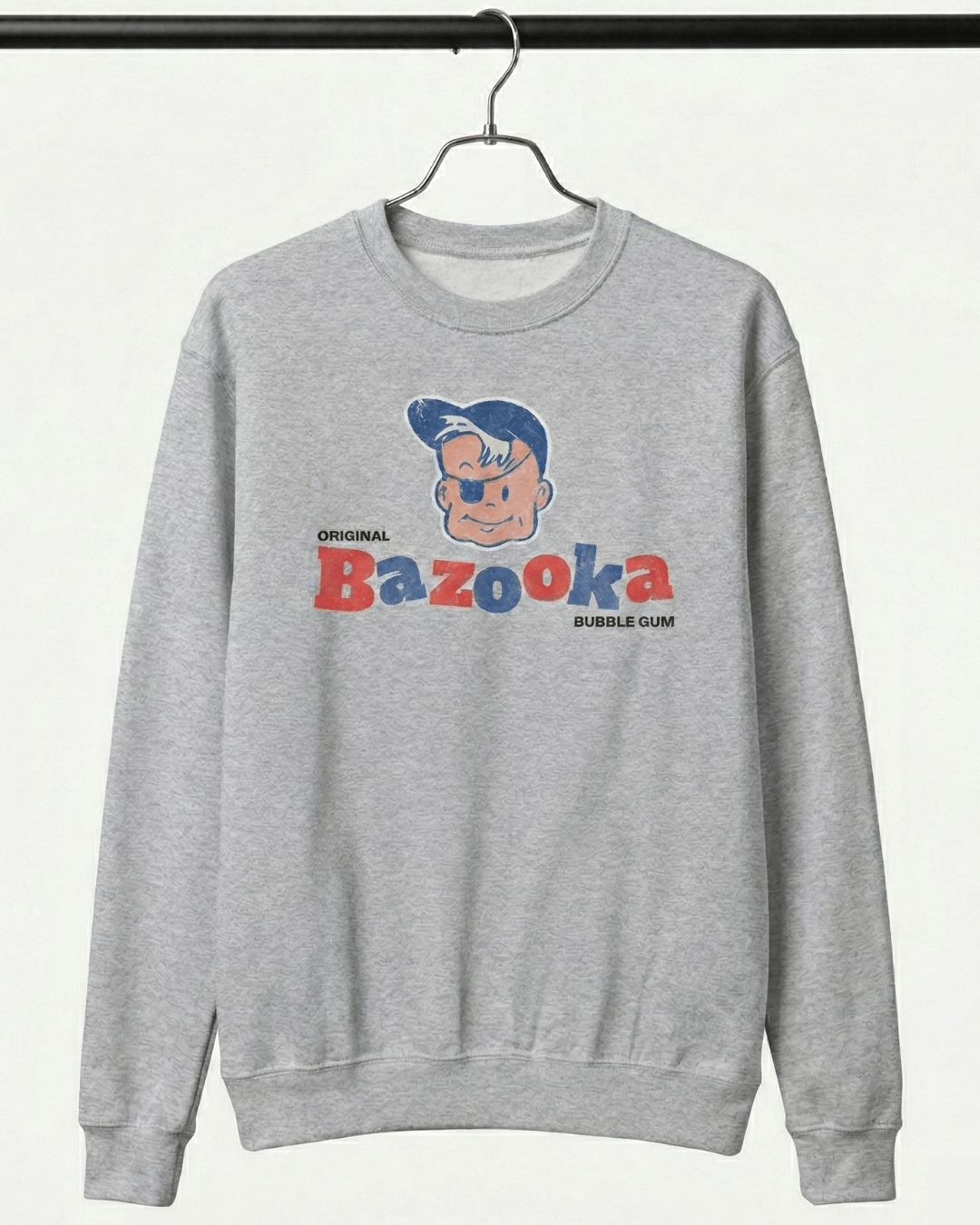 BAZOOKA JOE SWEATER | RETRO BUBBLEGUM CLUB on a gray sweatshirt featuring original Bazooka bubble gum design.
