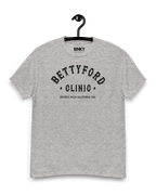 BETTY FORD CLINIC VARSITY T-SHIRT hanging on a hook, featuring a vintage design and relaxed fit.