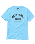 Betty Ford Clinic T-Shirt | Varsity Team in light blue with bold lettering and sporty design.