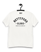 Front view of BETTY FORD CLINIC VARSITY T-SHIRT on hanger, featuring bold black print and retro design.