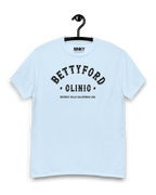BETTY FORD CLINIC VARSITY T-SHIRT displayed on a hanger, featuring bold retro typography, ideal for casual wear.