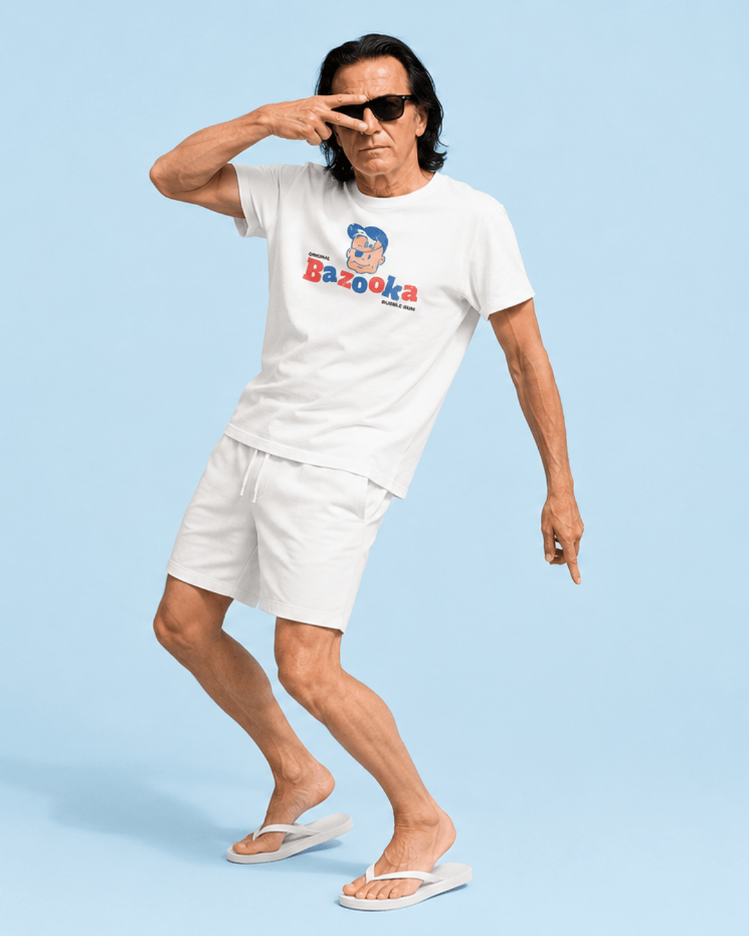 Model wearing Bazooka Joe T-Shirt | Retro Bubblegum Legend, posing in stylish shorts against a blue background.