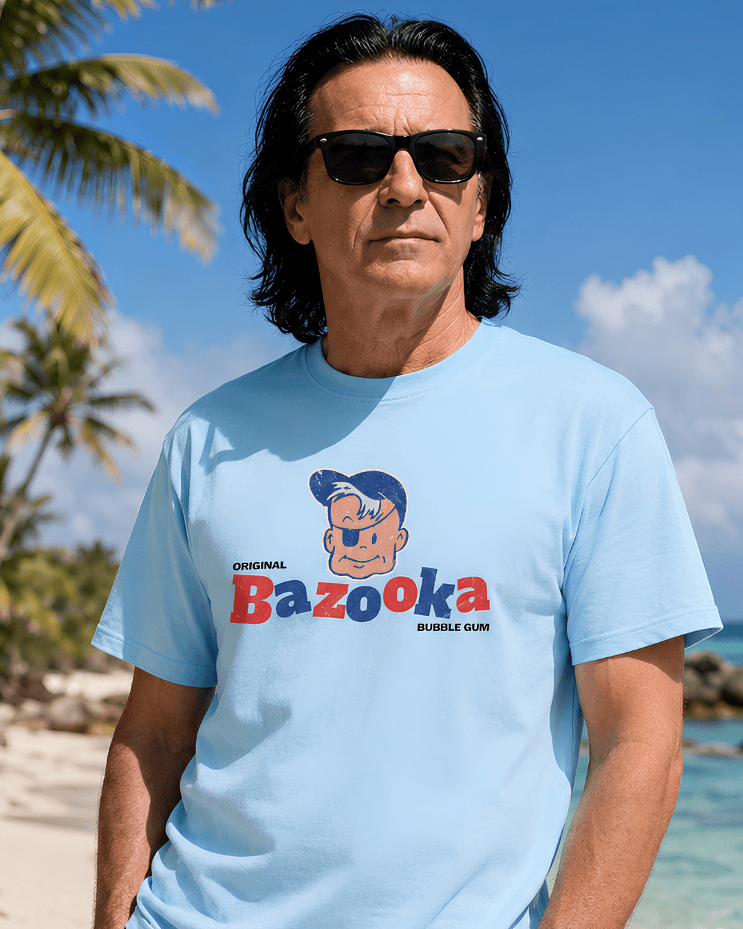 Bazooka Joe T-Shirt | Retro Bubblegum Legend worn by man at beach, with tropical background and sunglasses.