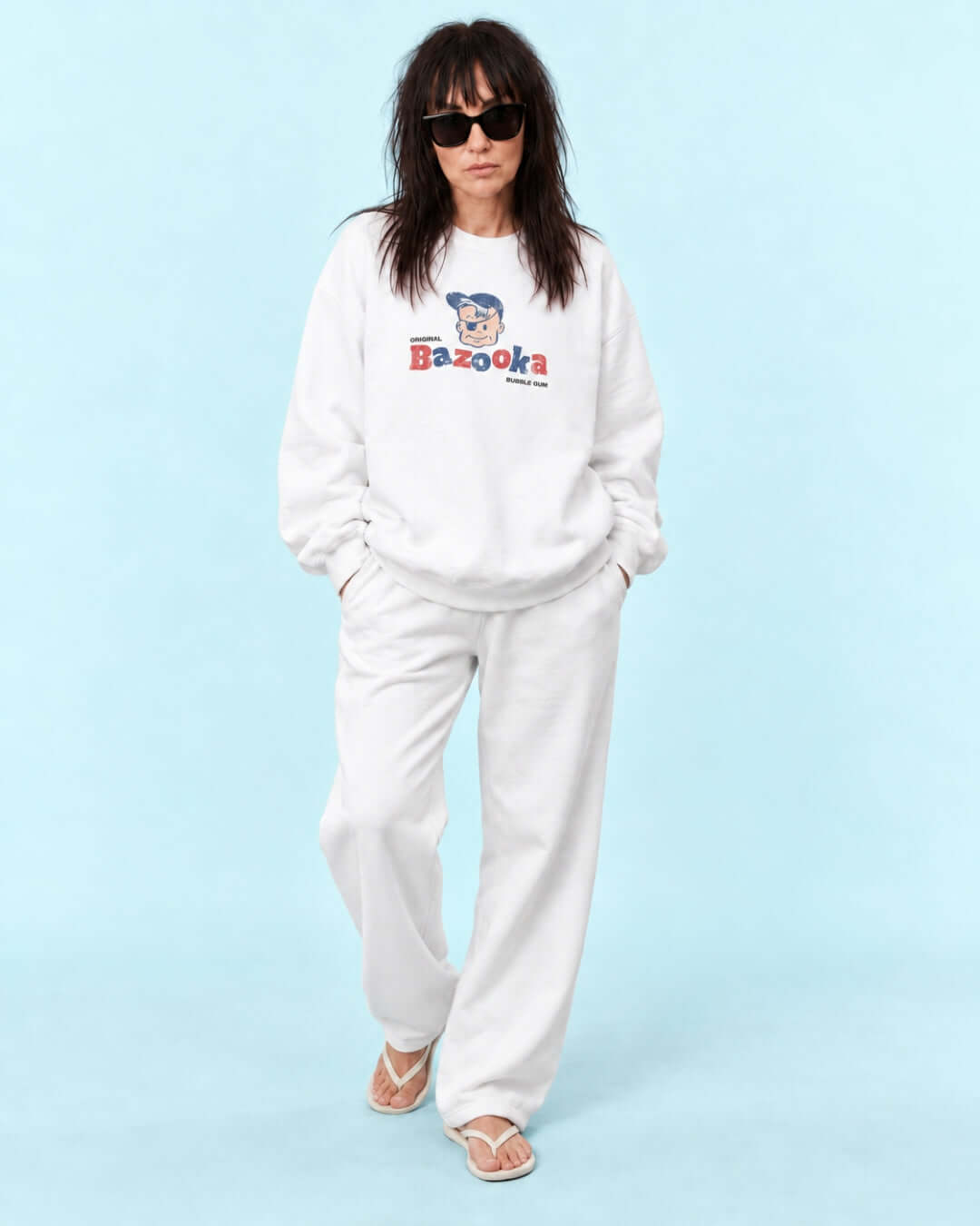 Helga wearing the BINKY Bazooka Joe Club Heavy Sweater in White with distressed retro bubblegum graphic.