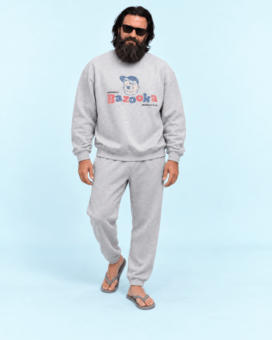 Man wearing the Bazooka Joe Club Heavy Sweater, showcasing bubblegum memories in a casual setting.