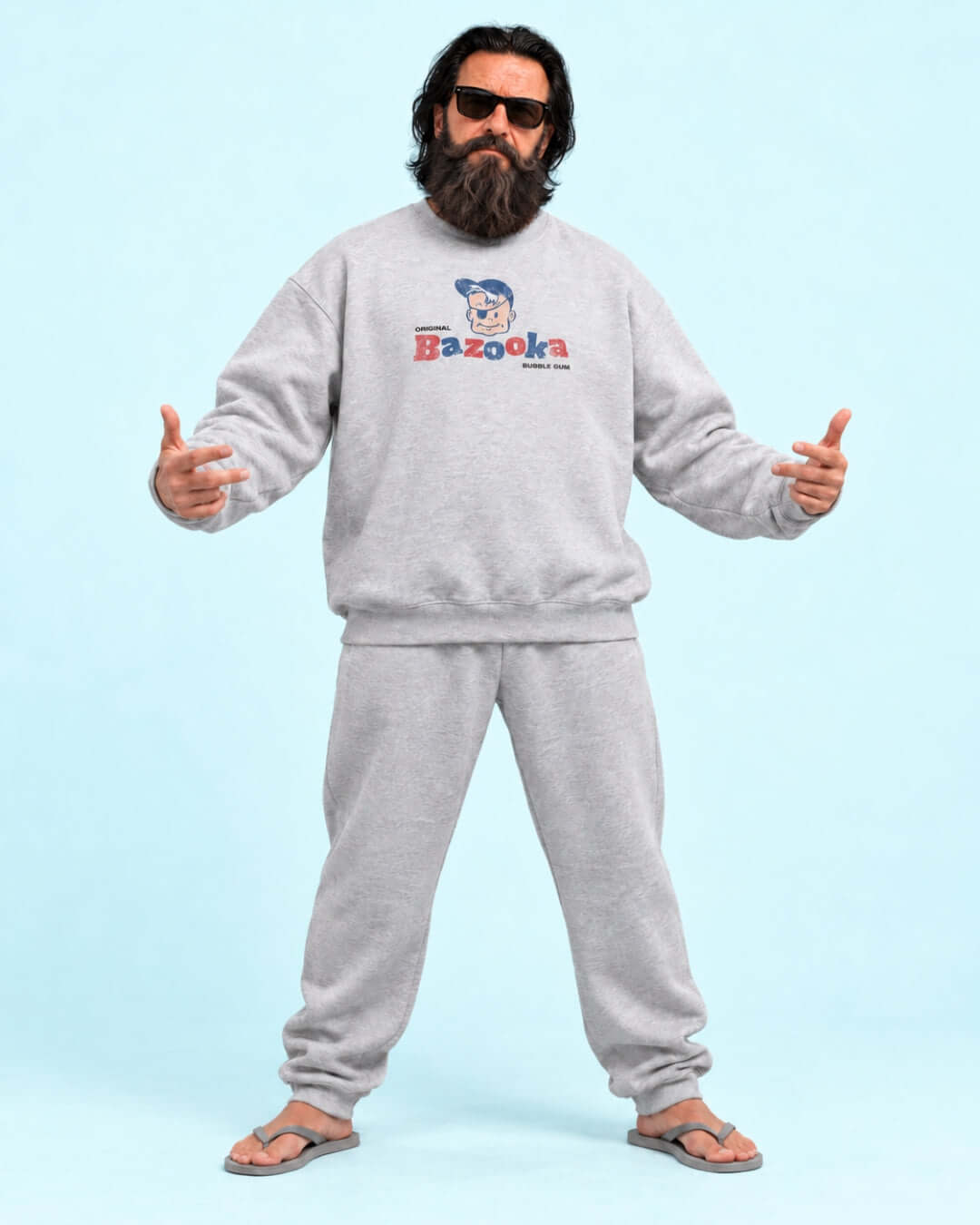Walter wearing the BINKY Bazooka Joe Club Heavy Sweater in heather grey with distressed retro bubblegum graphic.