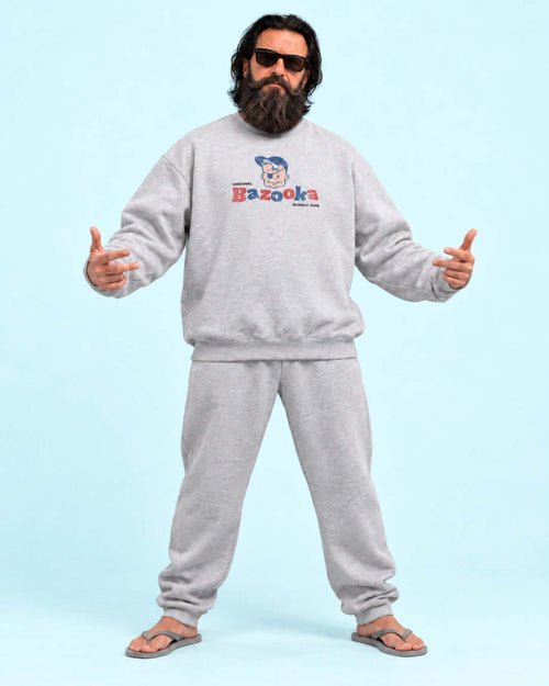 Walter wearing the BINKY Bazooka Joe Club Heavy Sweater in heather grey with distressed retro bubblegum graphic.