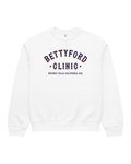 Betty Ford Clinic RWB Heavy Sweater in White, front view showing the oversized heavyweight fit and red, white and navy varsity print.