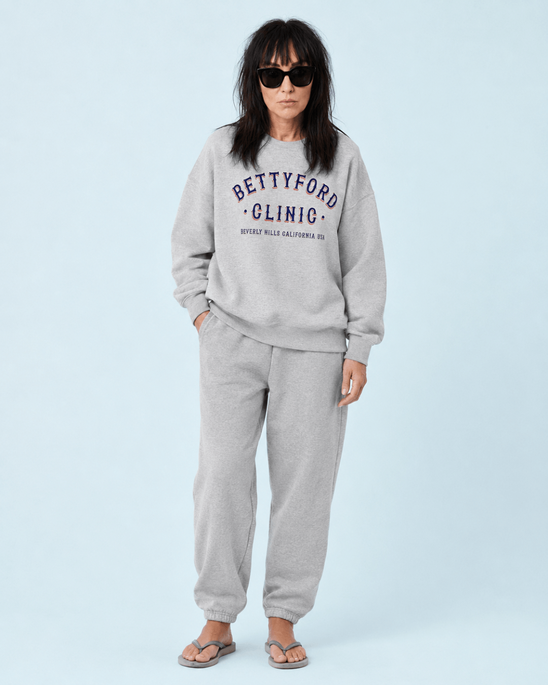 Woman wearing a Betty Ford Clinic RWB Heavy Sweater with a stylish look and relaxed fit.