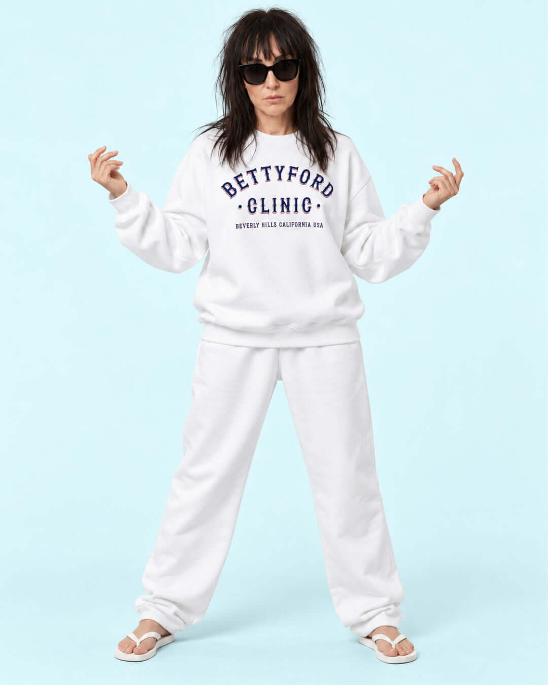 Helga wearing the BINKY Betty Ford Clinic RWB Heavy Sweater with red, white and navy varsity graphic.