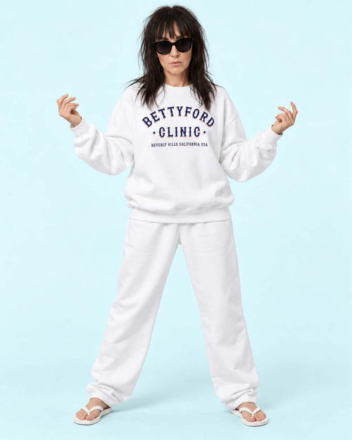 Helga wearing the BINKY Betty Ford Clinic RWB Heavy Sweater with red, white and navy varsity graphic.