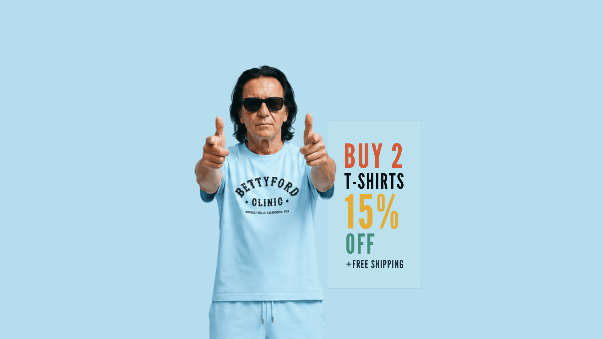 Man wearing a light blue t-shirt with BETTYFORD CLINIC text, promoting 15% off when buying 2 t-shirts with free shipping.