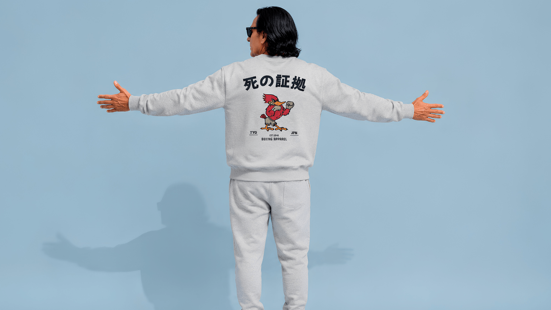 Person wearing a Japanese boxing sweater with 'The Fighting Spirit' design, showcasing a vintage boxing aesthetic.