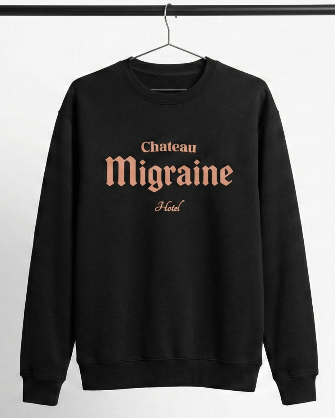 HOTEL MIGRAINE HEAVY SWEATER featuring Chateau Migraine graphic on a black oversized sweatshirt.