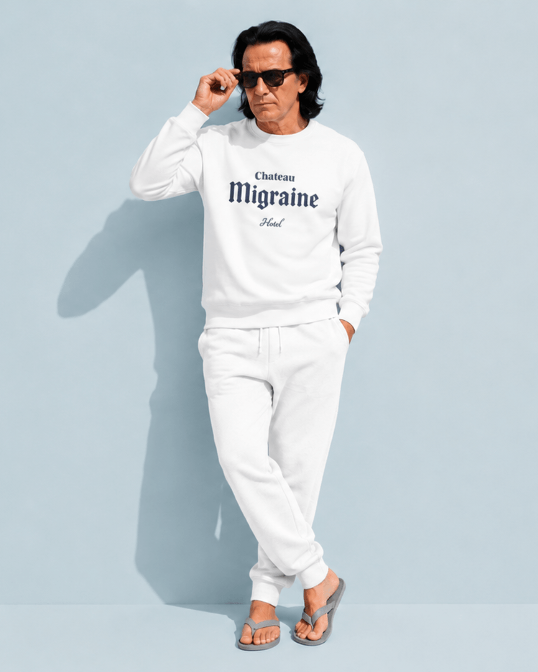 Hotel Migraine Heavy Sweater worn by a man in sunglasses, featuring a stylish design with hotel branding.