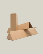 Various cardboard packaging shapes on a neutral background, showcasing eco-friendly materials.