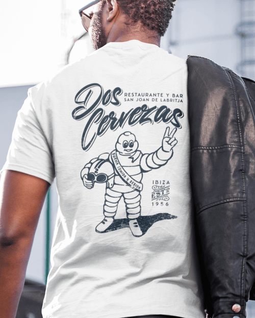 Man wearing DOS CERVEZAS IBIZA T-SHIRT, featuring a minimalist design and relaxed fit, perfect for summer vibes.