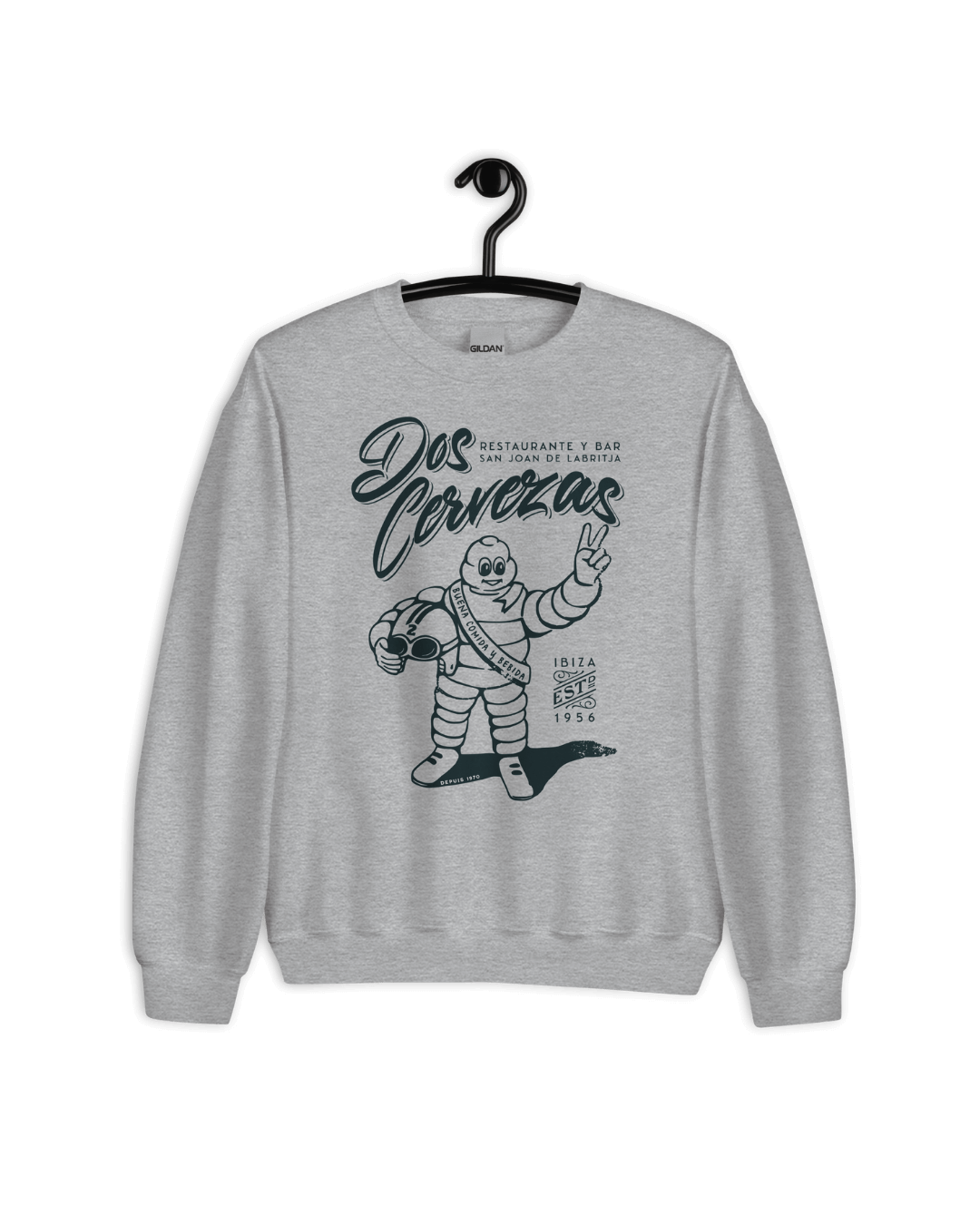 DOS CERVEZAS IBIZA SWEATER featuring a graphic design of a character in a fun pose on a grey background.