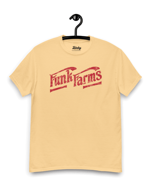 FUNK FARMS T-SHIRT displayed on a hanger, featuring a vintage design in bold red text on a light yellow background.