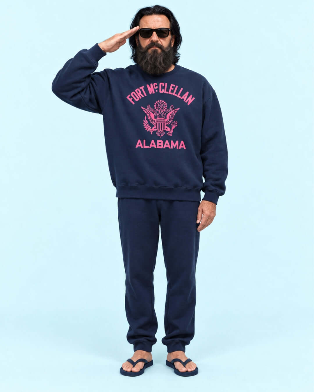 Walter wearing the Navy BINKY Fort McClellan Heavy Sweater with pink front graphic