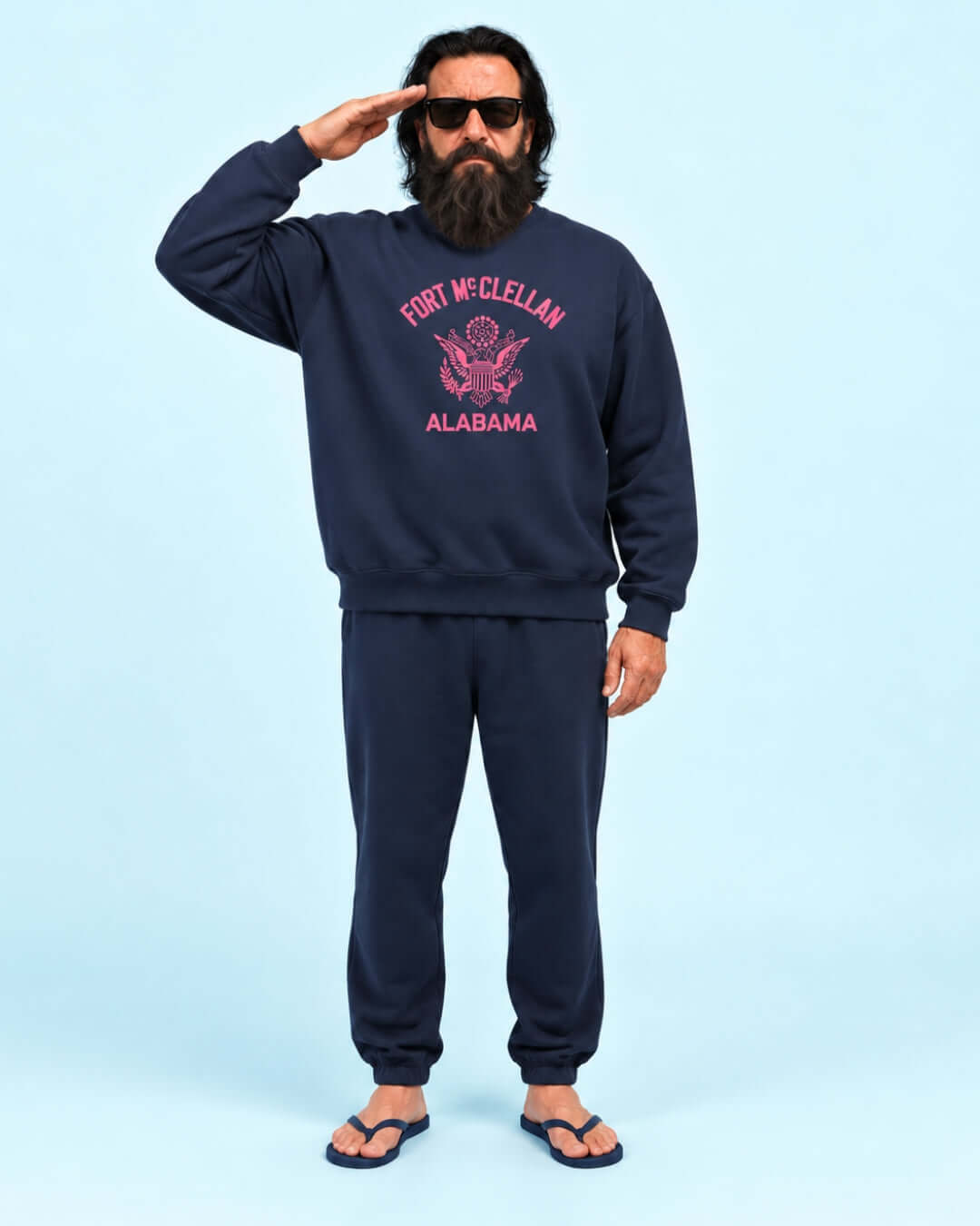 Helga wearing the Navy BINKY Fort McClellan Heavy Sweater with pink front graphic