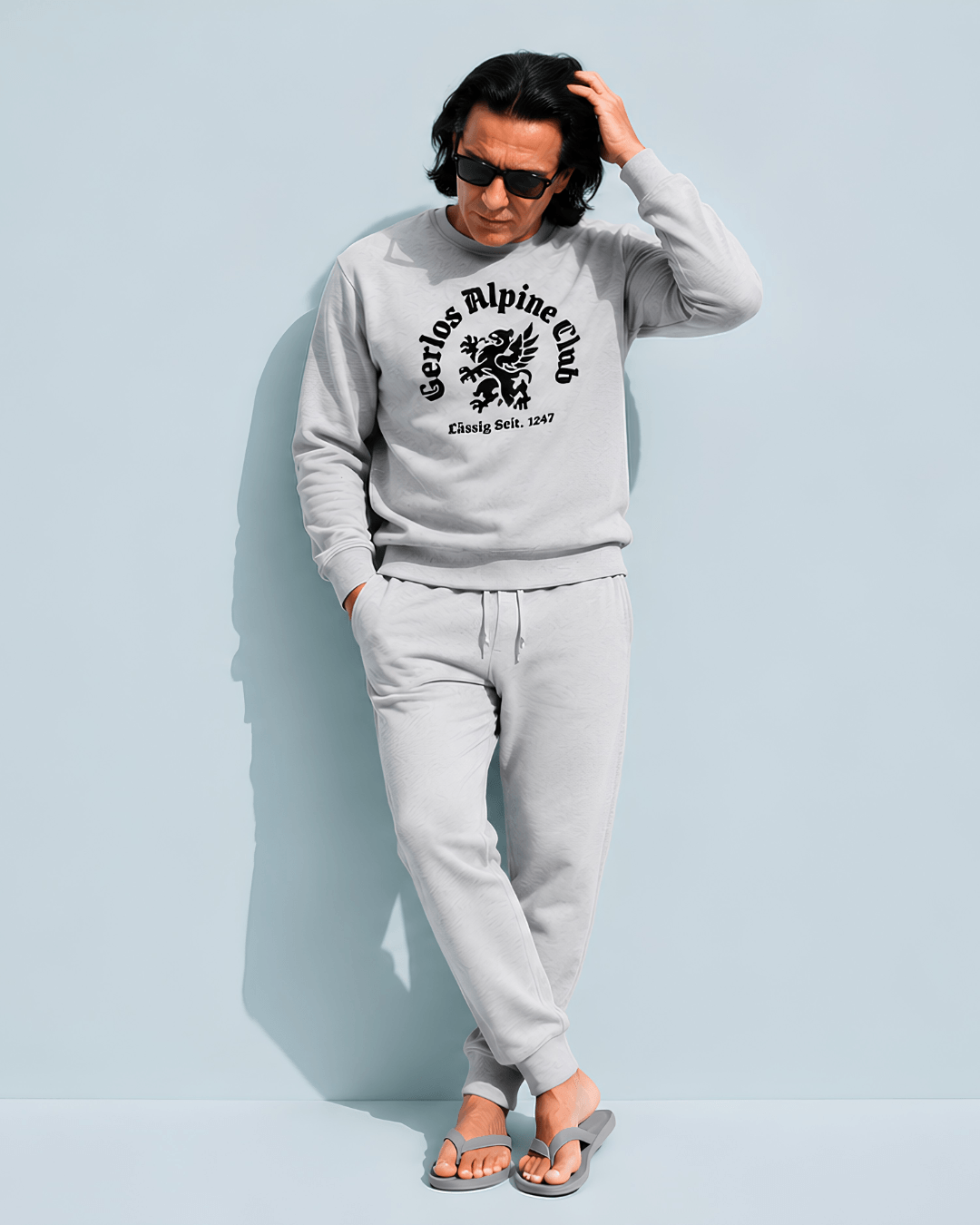Gerlos Alpine Club Heavy Sweater model wearing casual outfit with Griffin crest, perfect for winter leisure activities.
