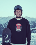 Man wearing HOTEL KITZBÜHEL HEAVY SWEATER with vintage hotel crest, snowy mountains in background, ski culture aesthetic.