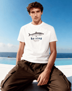 Model wearing HERRING T-SHIRT by Binky Comfywear, showcasing Dutch heritage with a relaxed fit.