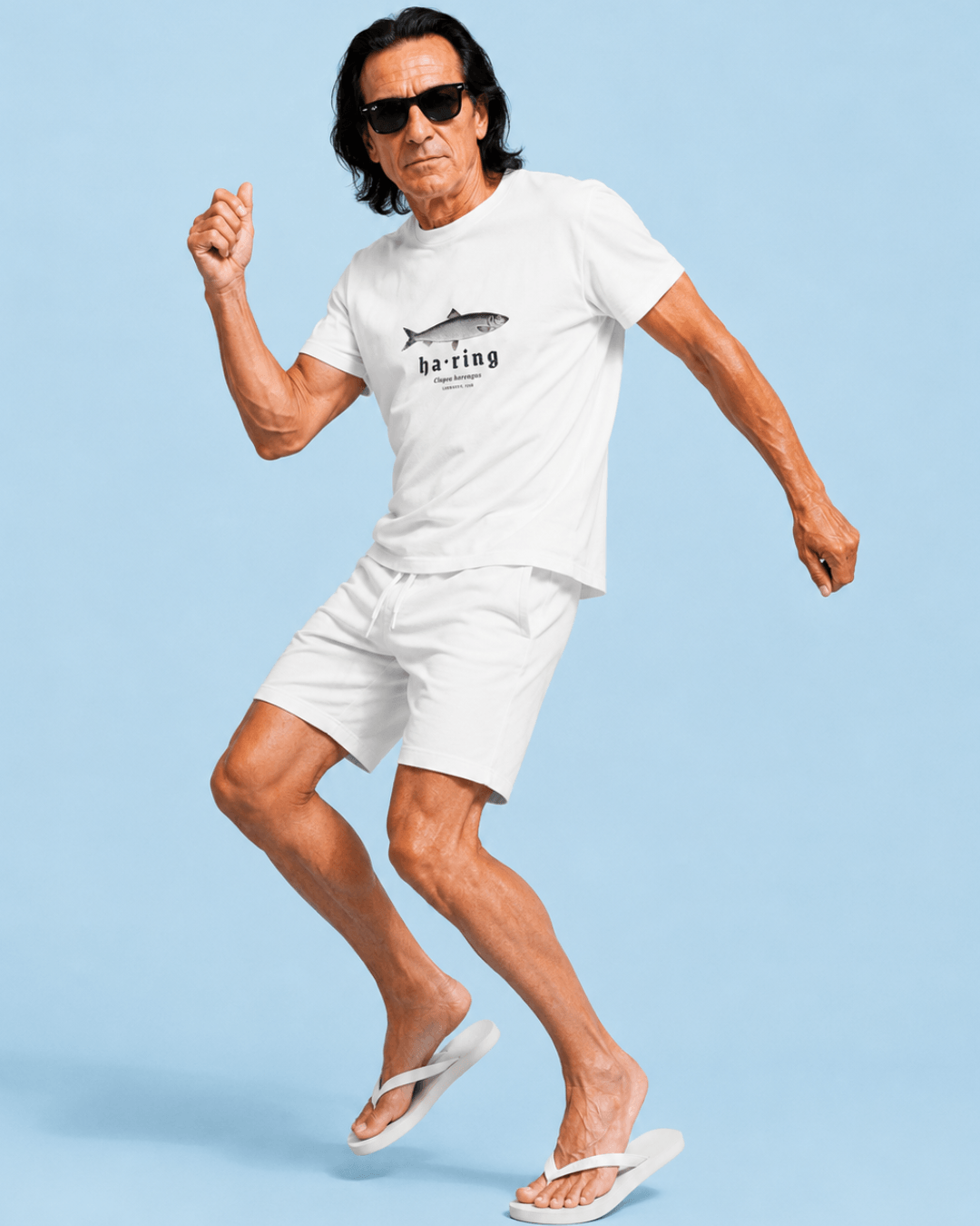 Model wearing Herring T-Shirt | Dutch Classic Raw, showcasing a stylish design and relaxed vibe on a blue background.