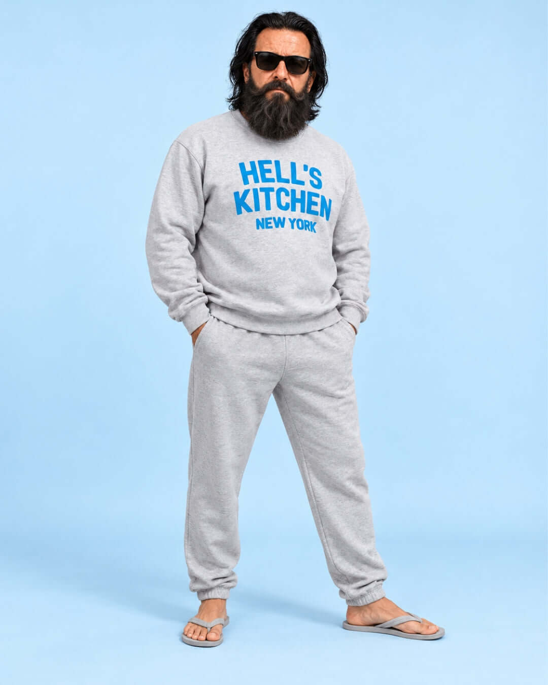 Walter wearing the Sport Grey Hell's Kitchen NY Soft Sweater with blue lettering and grey joggers