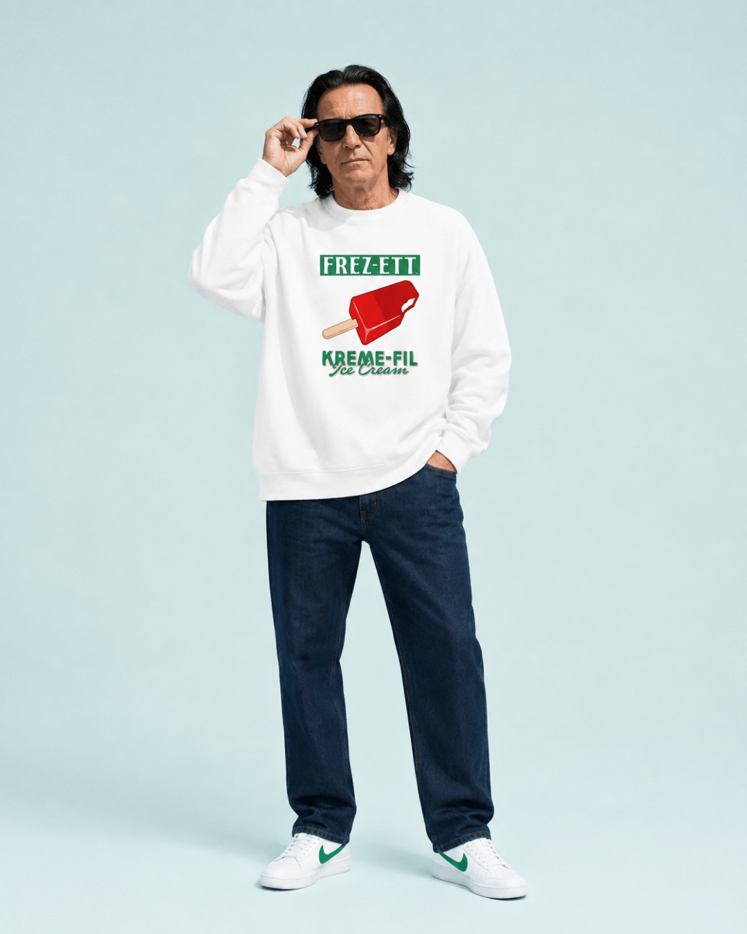 Man wearing Ice Cream Heavy Sweater with a red frozen treat graphic and sunglasses.