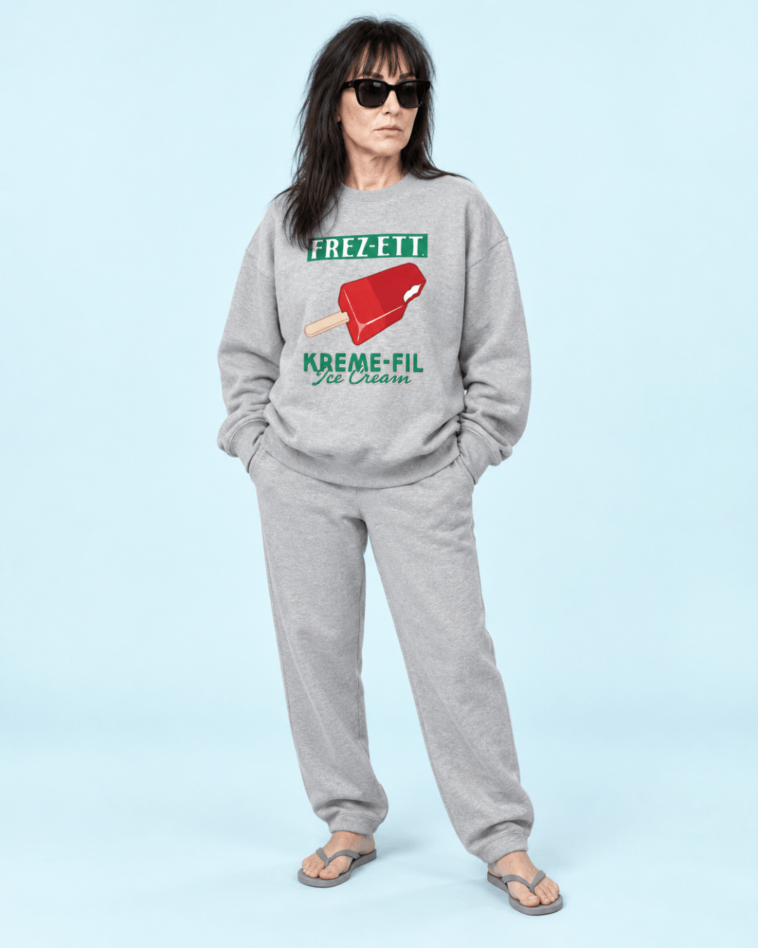 Female model wearing the BINKY Ice Cream Heavy Sweater with retro FREZ-ETT. KREME-FIL ice cream graphic.