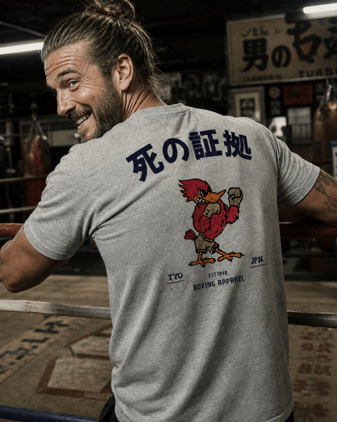 Japan Boxing T-shirt | Retro Fighting Spirit worn by a man in a boxing gym, showcasing back graphic design.