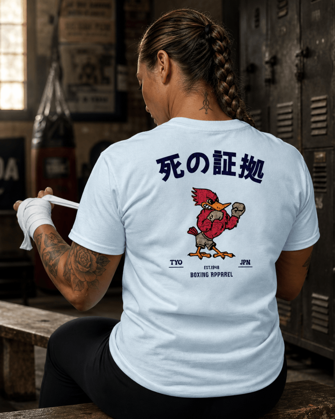 Woman wearing Japan Boxing T-shirt | Retro Fighting Spirit with a graphic of a bird in a boxing stance.