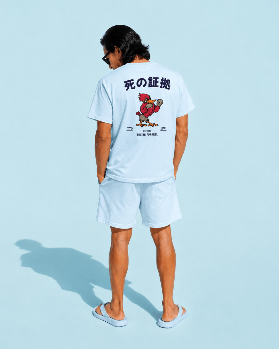 Person wearing a Japan Boxing T-Shirt | Retro Fighting Spirit against a light blue background.