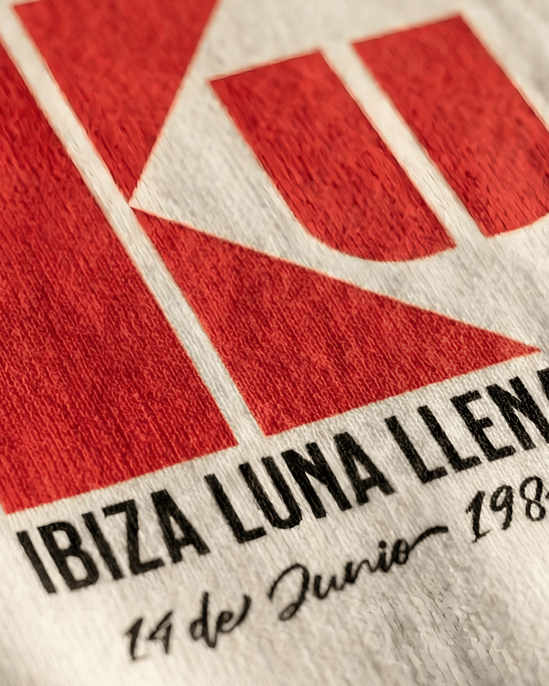 Close-up of the KU IBIZA SWEATER | 1984 CLUB LEGEND showcasing the iconic logo and vibrant design.