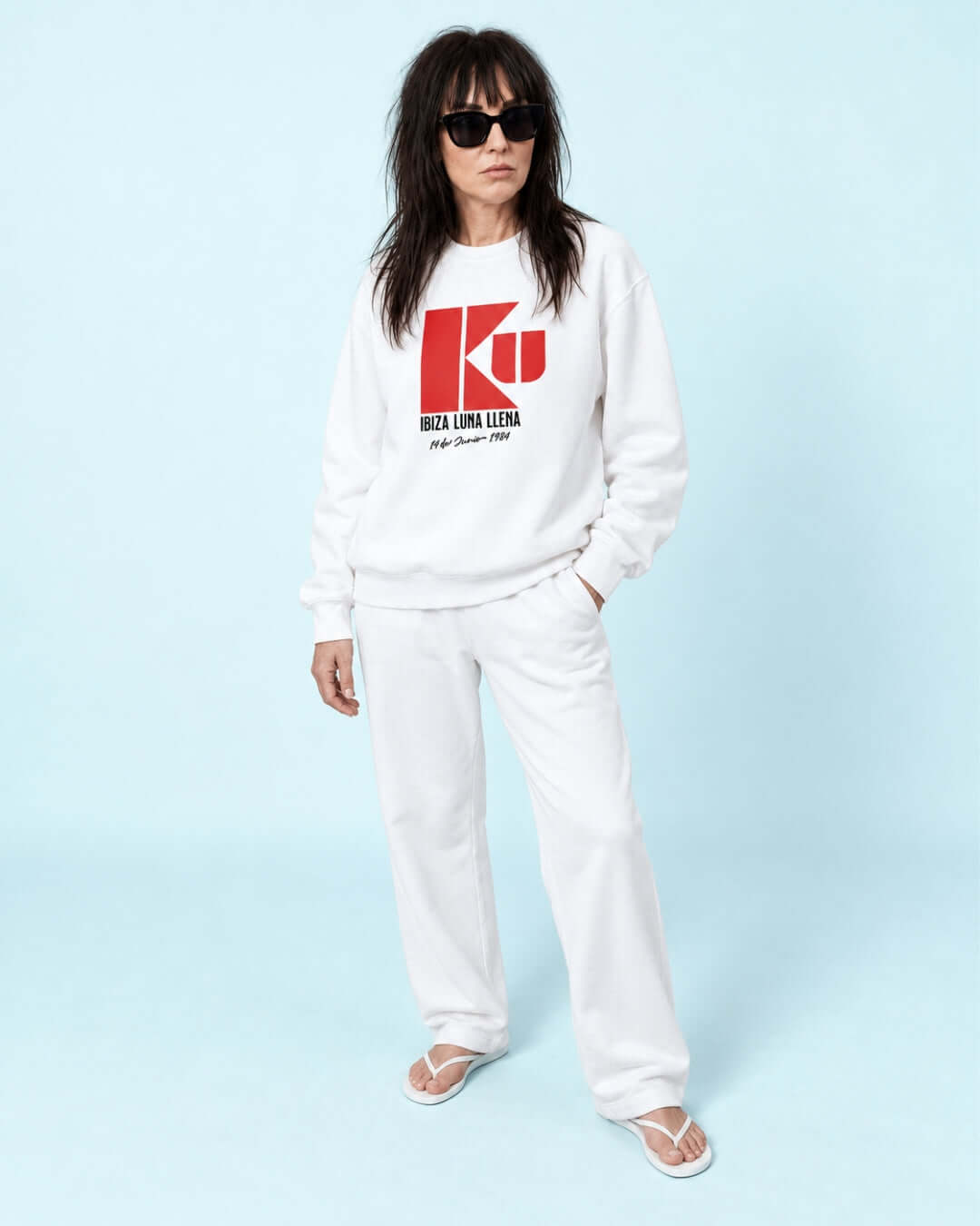 Helga wearing the BINKY KU Ibiza 1984 Heavy Sweater in White with red retro club graphic.