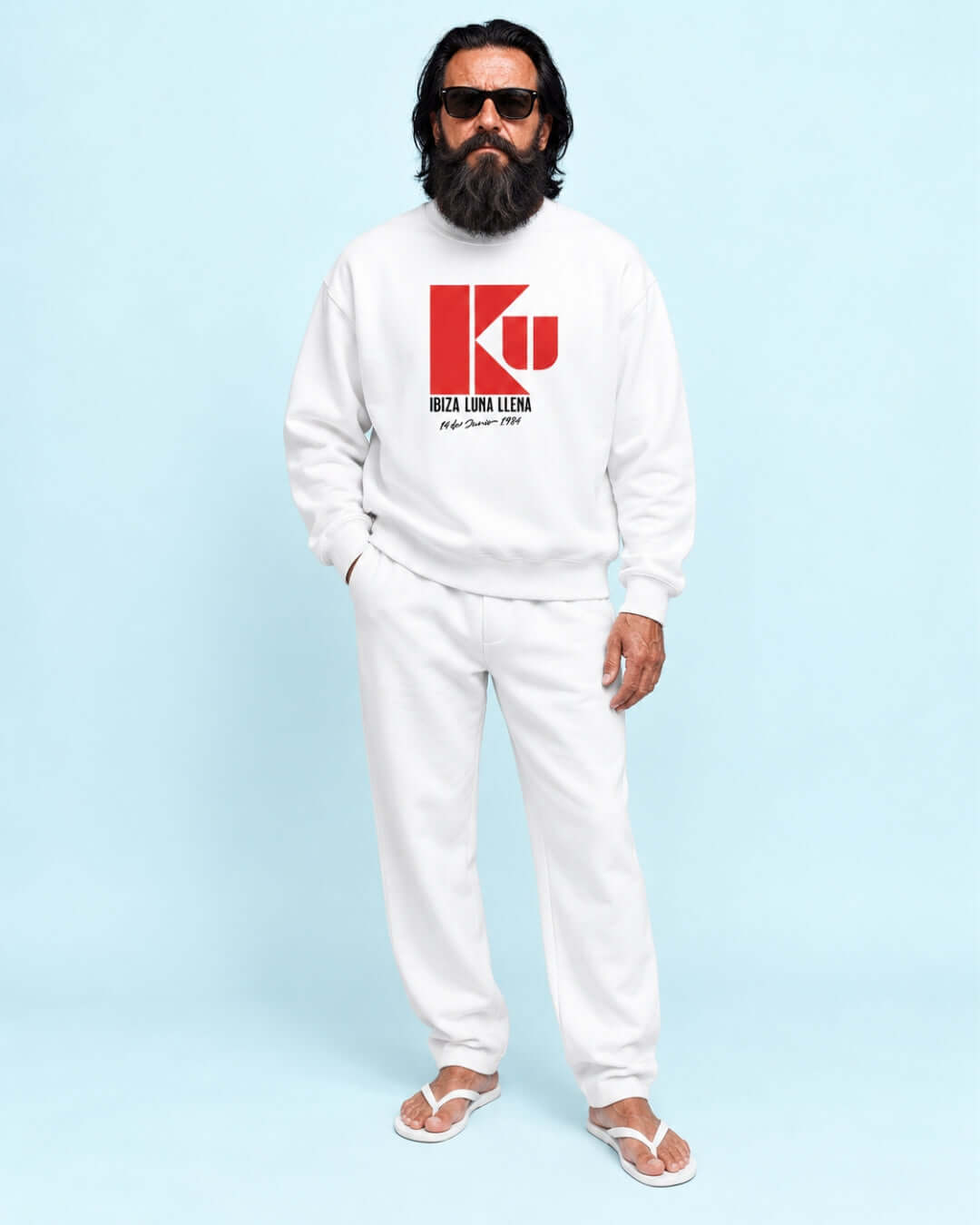 Walter wearing the BINKY KU Ibiza 1984 Heavy Sweater in White with red retro club graphic.