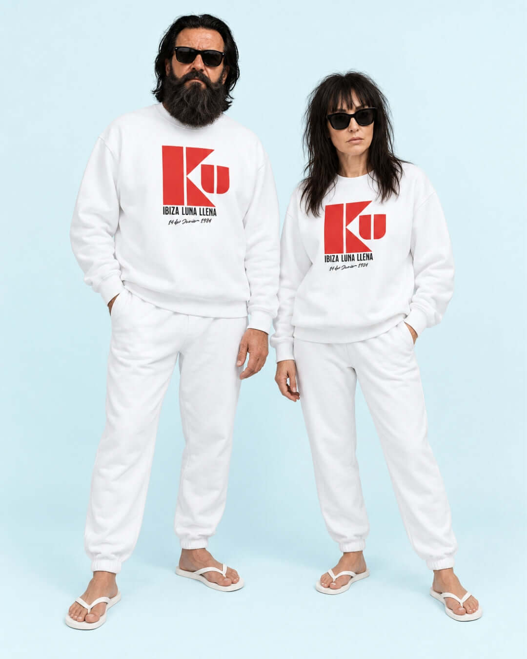 Walter and Helga wearing the BINKY KU Ibiza 1984 Heavy Sweater in White with red retro club graphic.