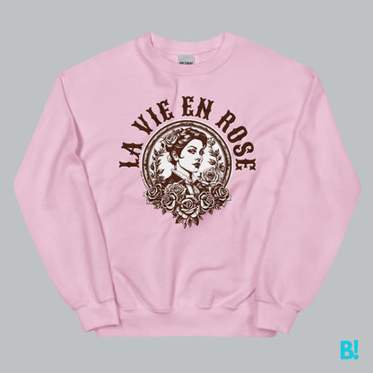 Pink LA VIE EN ROSE sweater with floral design and vintage illustration, made from plush 50/50 fabric blend