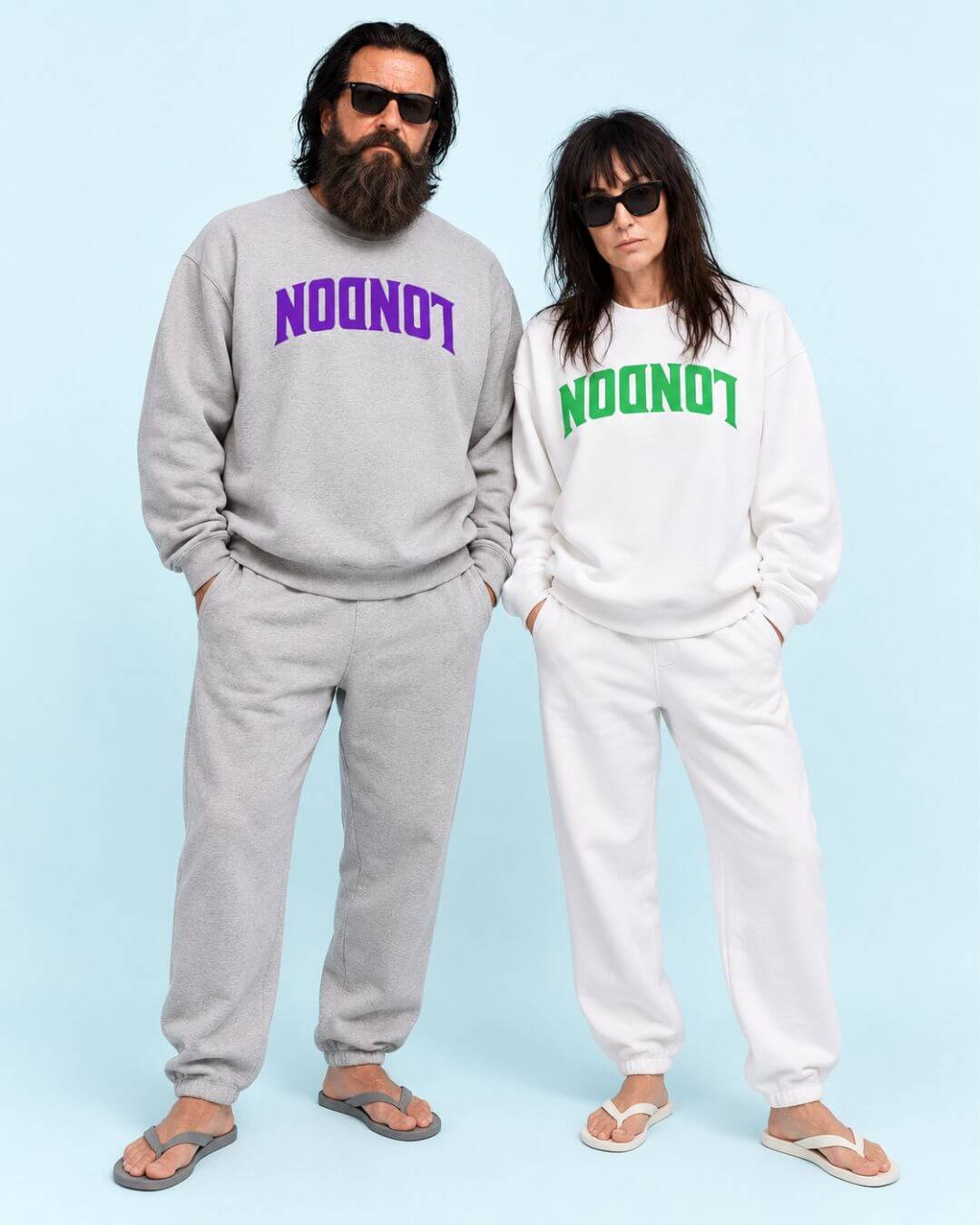 Walter and Helga wearing BINKY COMFYWEAR London Heavy Sweaters in Athletic Heather with purple and White with bright green inverted LONDON graphics.
