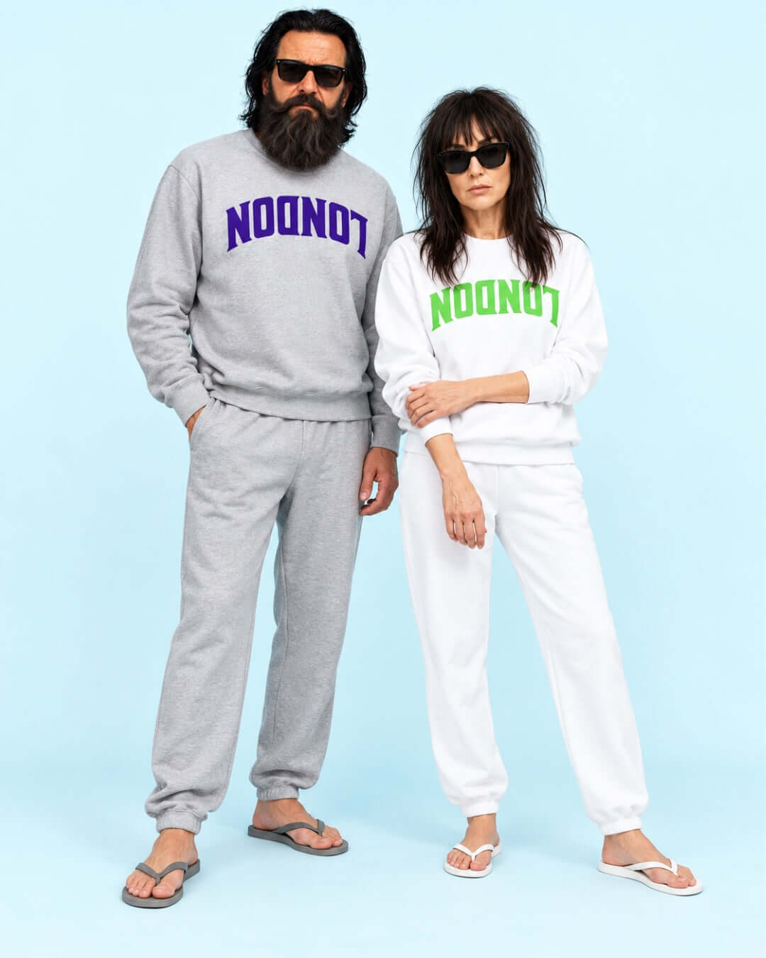 Walter and Helga wearing the BINKY London Soft Sweater in Sport Grey and White against a light blue studio background.