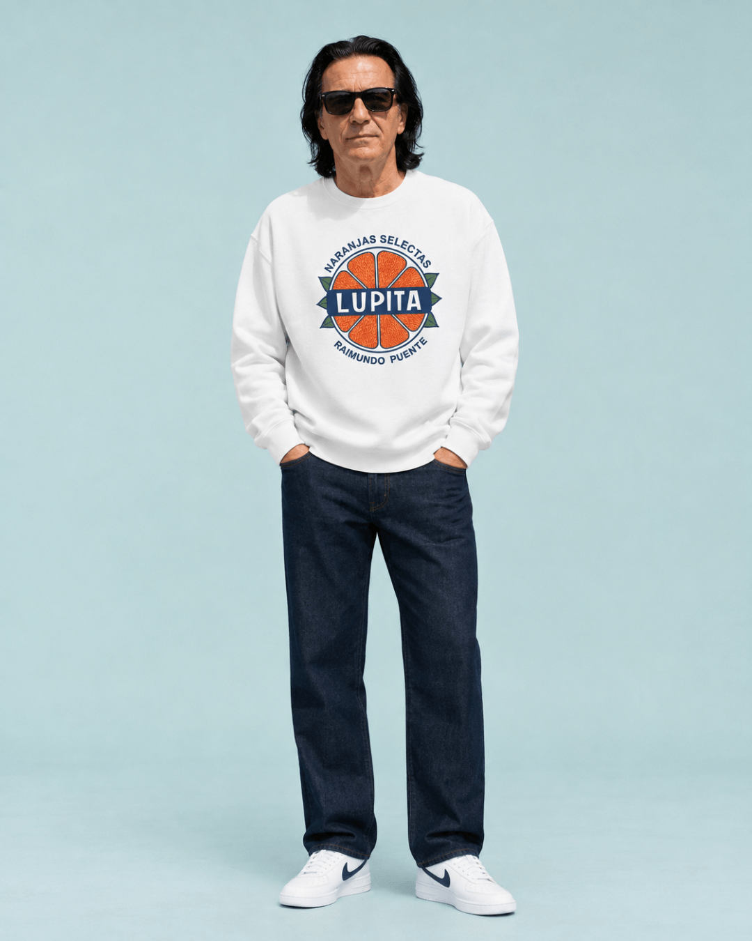 Lupita Naranjas Heavy Sweater worn by a model, showcasing its vintage-inspired citrus label design.