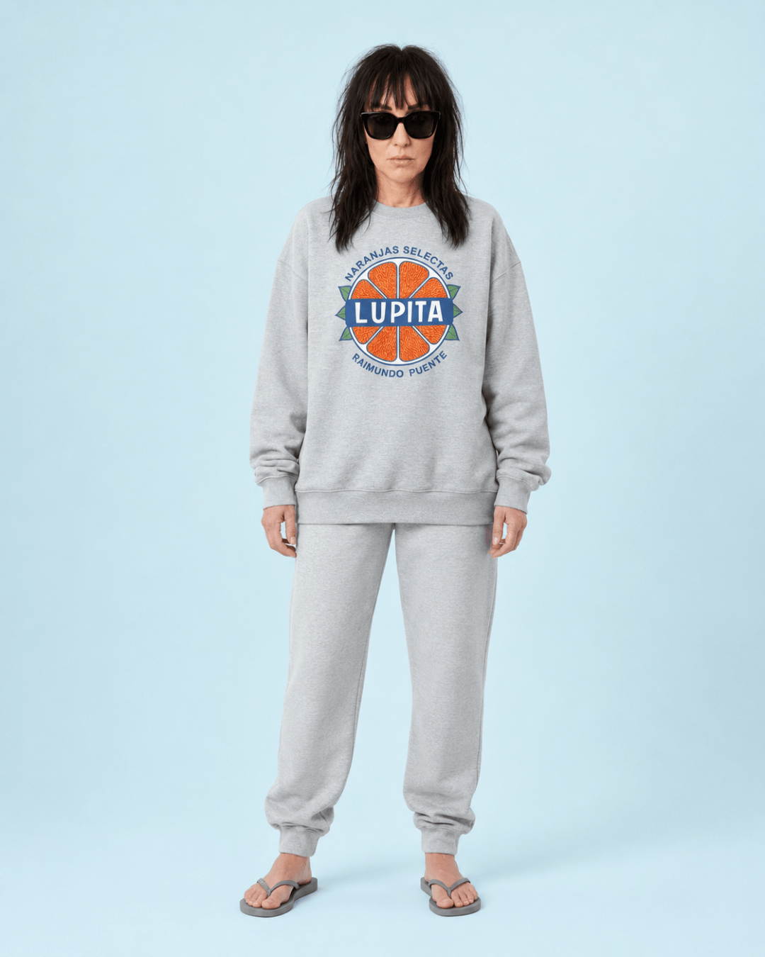 Lupita Naranjas Heavy Sweater worn by a woman with sunglasses, styled in a casual outfit.