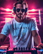 Man wearing a NEGRONI COCKTAIL T-SHIRT while playing music at a DJ booth with vibrant lights.