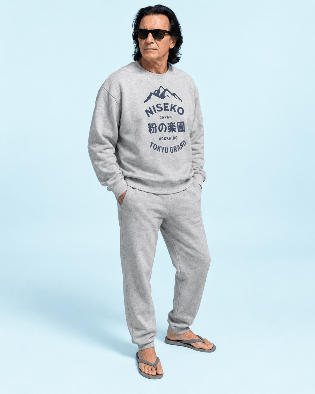 Niseko Powder Paradise Heavy Sweater worn by a man with sunglasses, styled casually in a light blue background.