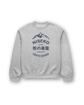 NISEKO POWDER PARADISE HEAVY SWEATER featuring mountain badge on a gray background.