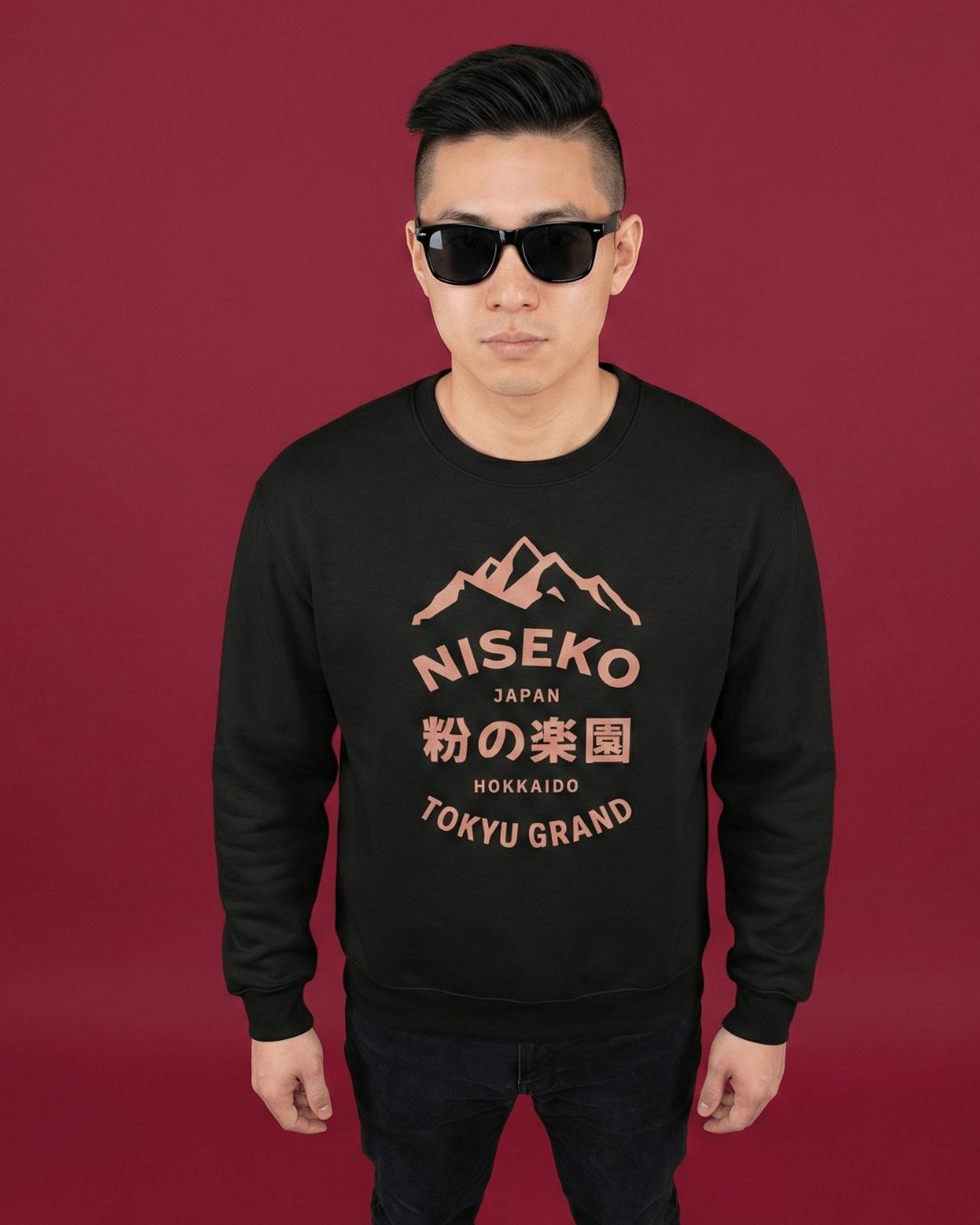 NISEKO POWDER PARADISE HEAVY SWEATER worn by a model against a burgundy background.