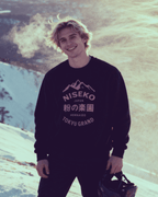 NISEKO POWDER PARADISE HEAVY SWEATER featuring mountains and Japanese text on a black sweatshirt.